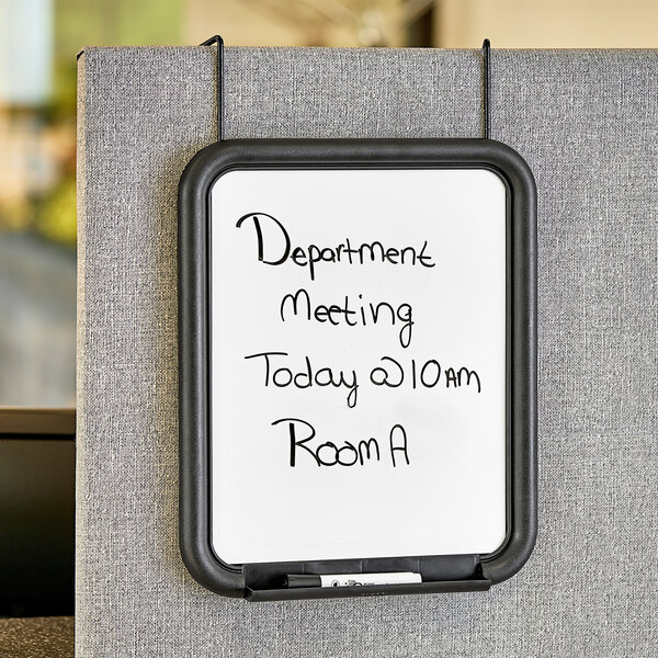 A white Safco Panelmate dry erase board with black text that says "Department Meeting Room"