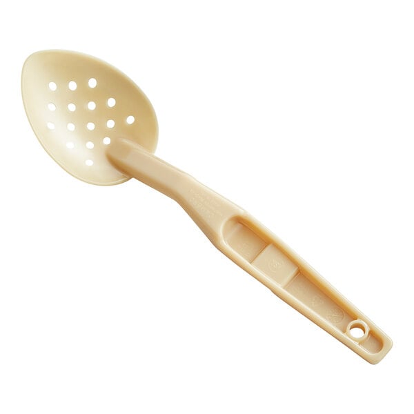 A beige plastic Cambro spoon with holes in it.