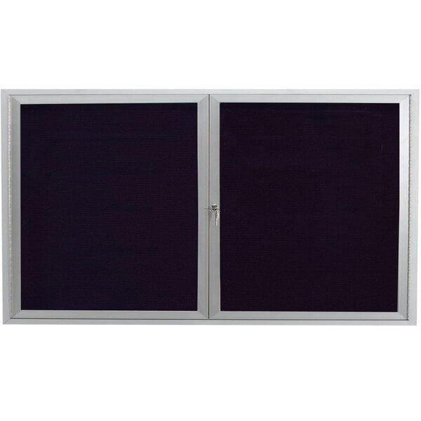 An Aarco satin anodized aluminum directory board with black letter board and 2 doors with a silver lock.