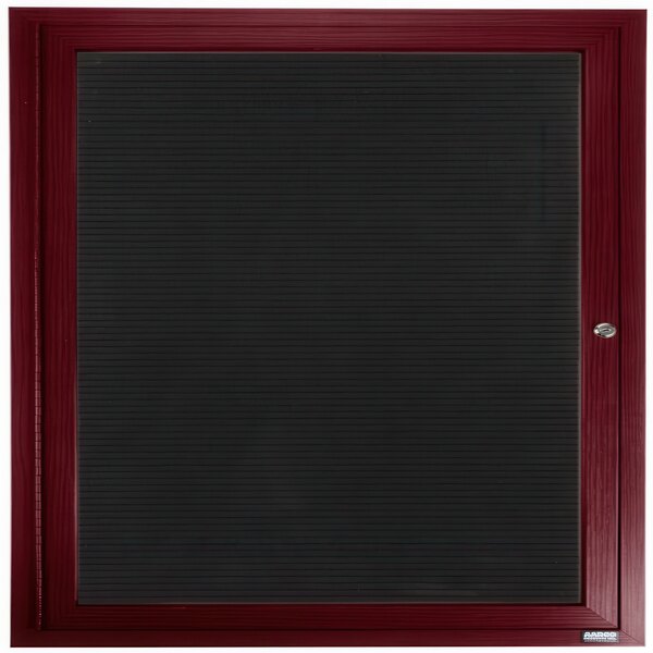 An Aarco cherry red outdoor directory board with a black vinyl letter board on a black frame with a door lock.