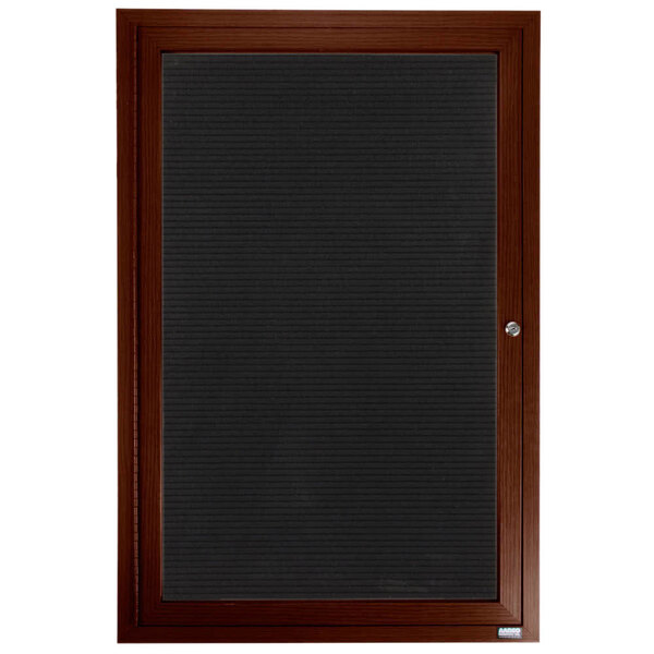 A walnut indoor directory board with a black frame and a black felt panel.