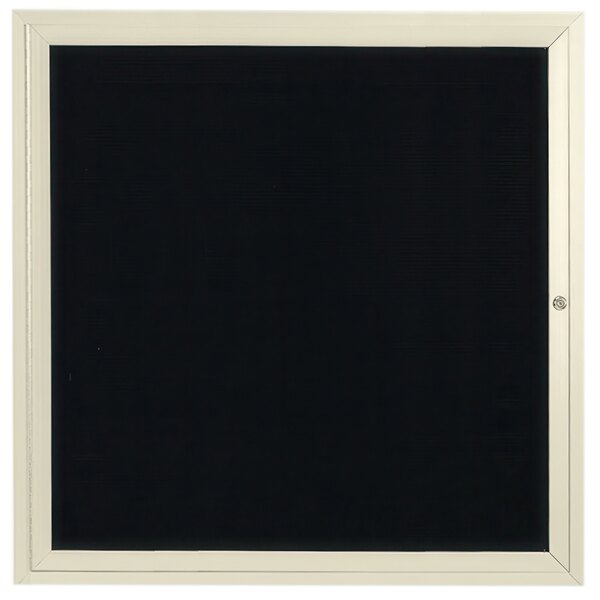 A black enclosed bulletin board with a white border and black letter board.