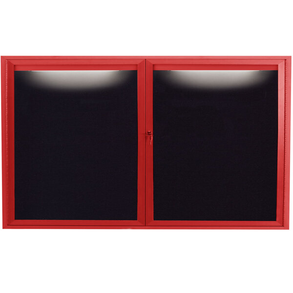 A red aluminum Aarco message center with black letter board panels behind glass doors with a lock.
