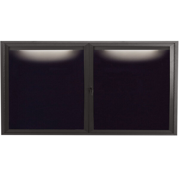 A black rectangular window with a black screen and a light on it.