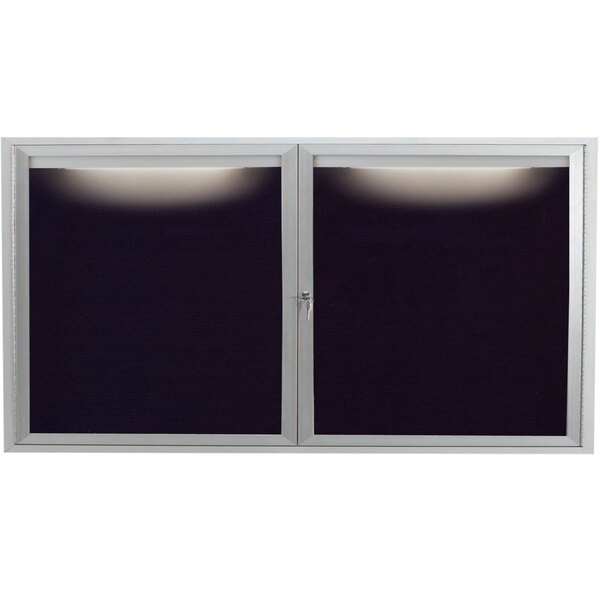 A black and satin anodized aluminum Aarco outdoor message center with black letter board behind two doors.