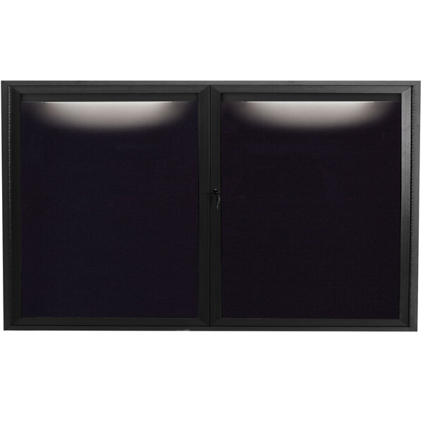 A black rectangular window with a white light on a black message center.