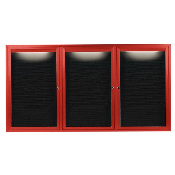 A red cabinet with black glass doors.