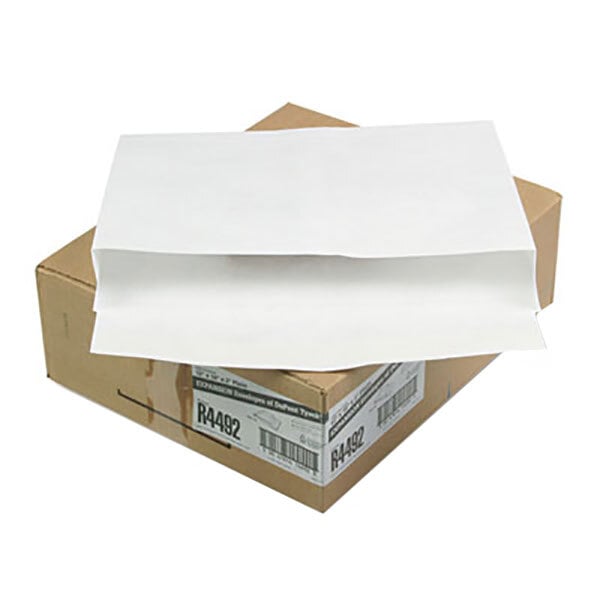 A brown box with white paper on it.