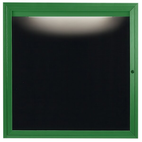 An Aarco green aluminum enclosed message center with a black letter board.