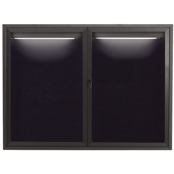 A black rectangular window with lights on it.
