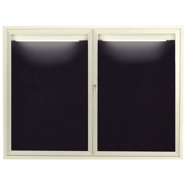 A white door with two black handles and a black letter board inside.