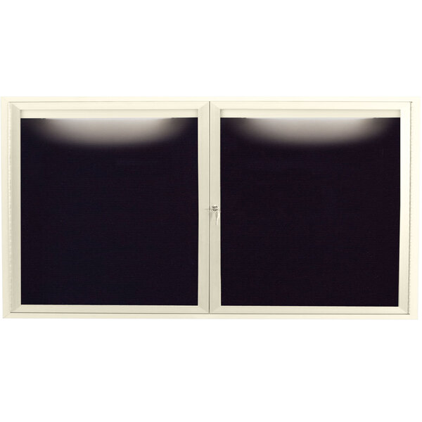 The ivory Aarco outdoor message center with two black letter boards behind glass doors.