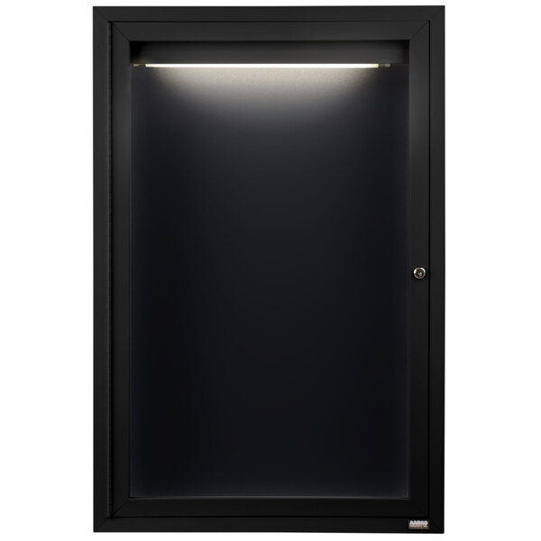 A black cabinet with a light on it.