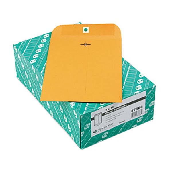 A green box of Quality Park brown envelopes with a yellow envelope on top.