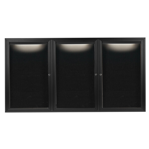 A black rectangular message center with three black glass doors and a black metal frame.