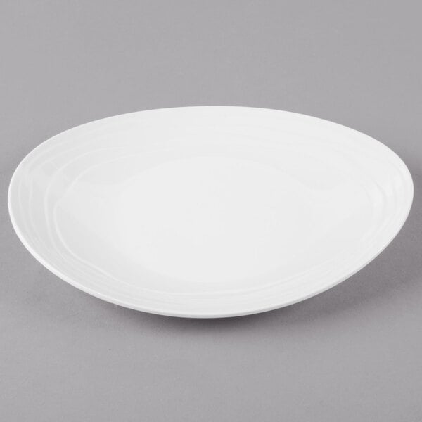 An ivory oval melamine platter with a textured rim.