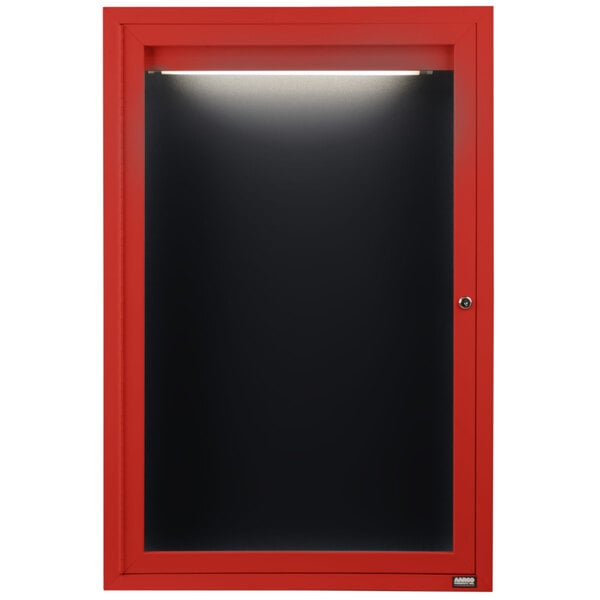 A red cabinet with a black door and black letter board inside.