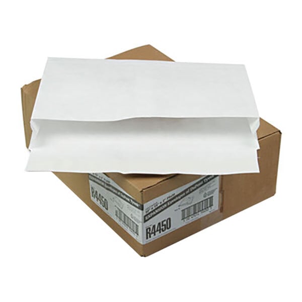A brown box with white Survivor Tyvek expansion mailers inside.