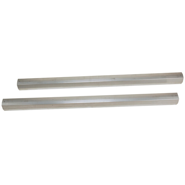 A pair of silver metal rectangular floor pads with white top tracks.