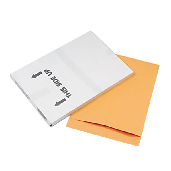 A white box with arrows on it next to a Quality Park brown Kraft jumbo file envelope with a fold flap seal in orange.