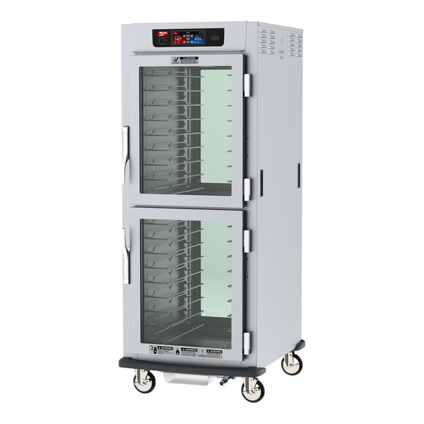 A Metro C5 9 series heated holding and proofing cabinet with clear Dutch doors.