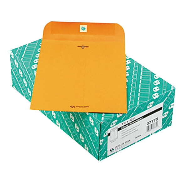 A green box of 100 Quality Park brown kraft file envelopes with an orange envelope on top.