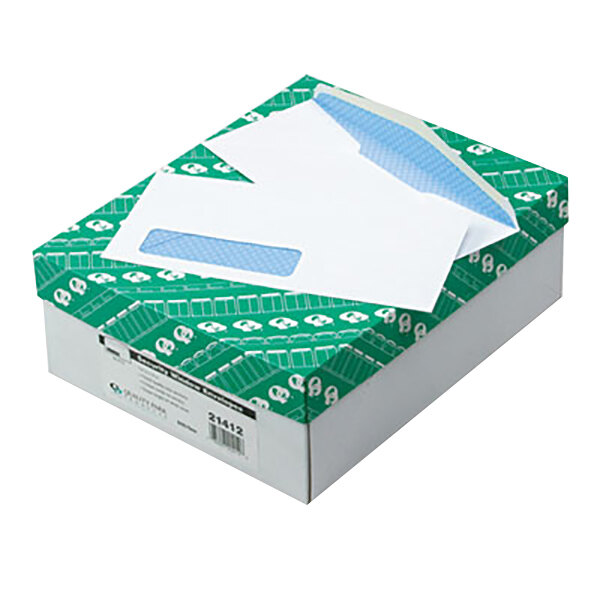 A box of Quality Park white envelopes with blue and white sheets inside.