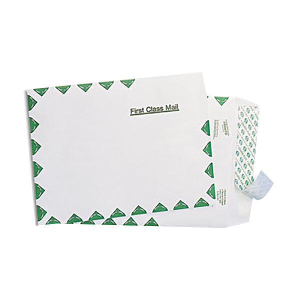 A stack of white U.S. Postal Service First Class Mailers with a green border.