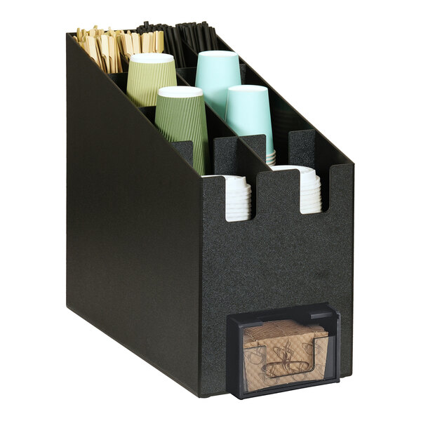 A black Cal-Mil countertop organizer with paper cups and straws in it.