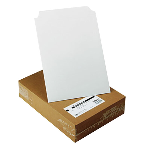 A cardboard box with a white label on it containing white Quality Park photo/document mailers.