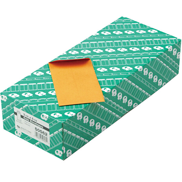 A green box of yellow Quality Park #5 1/2 brown Kraft coin envelopes.