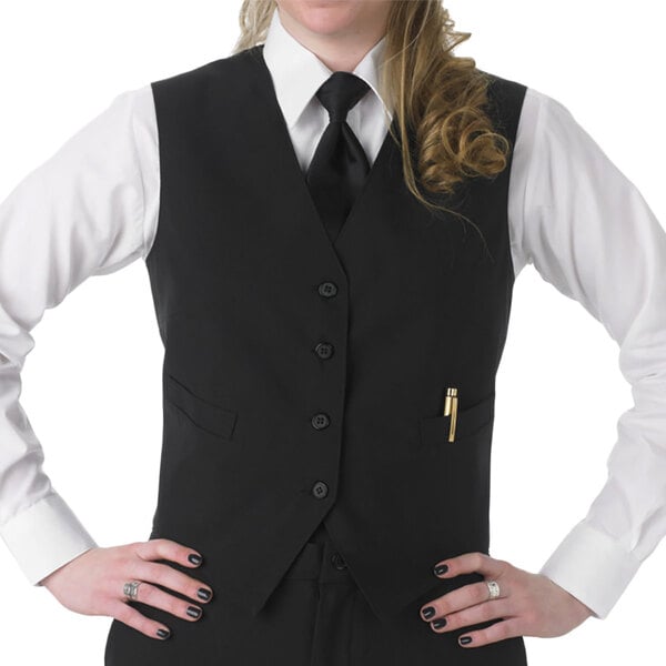 A woman wearing a Henry Segal black server vest and tie.