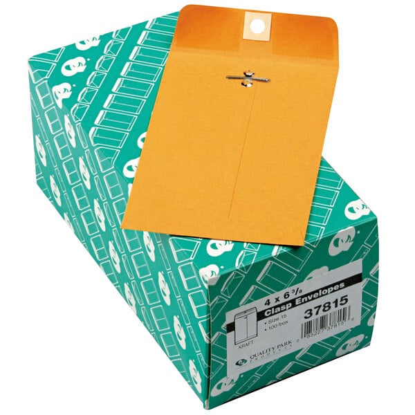 A green box of Quality Park brown file envelopes with a hole in the middle.