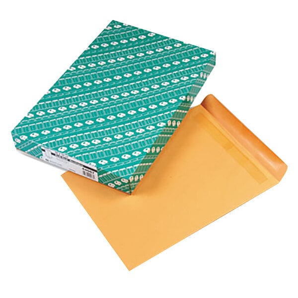 A green box with white designs and brown envelopes.