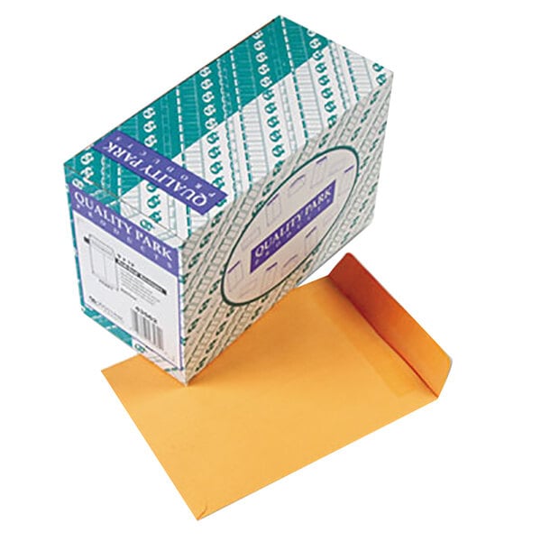 A box of Quality Park brown Kraft file envelopes with a label on it.