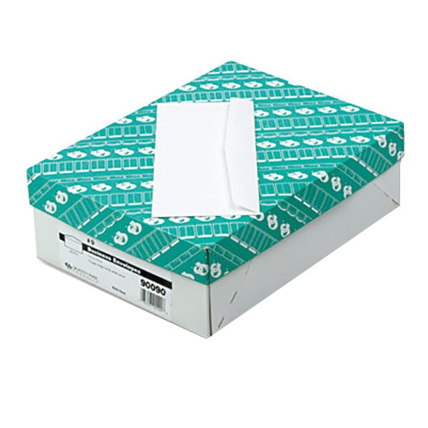 A green and white box of Quality Park white business envelopes.