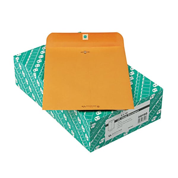 A brown box with green and brown Quality Park file envelopes.
