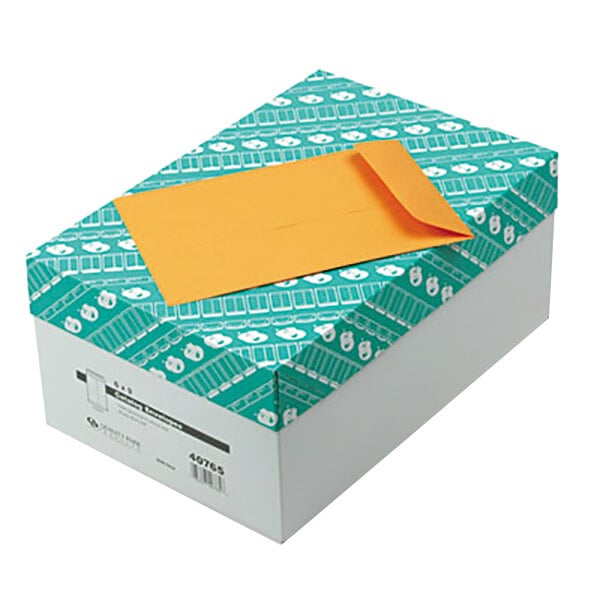 A white box of Quality Park brown Kraft file envelopes with gummed seals.