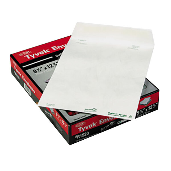 A white Tyvek mailer box with a red box on top.