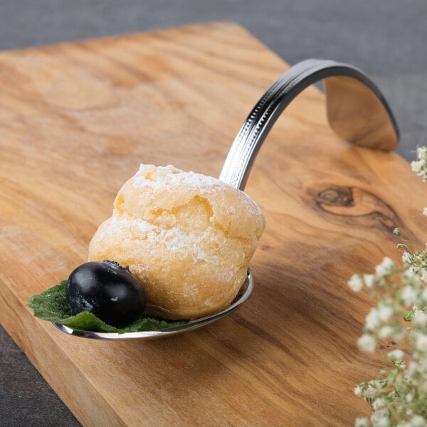 A Bon Chef stainless steel spoon with food on it.