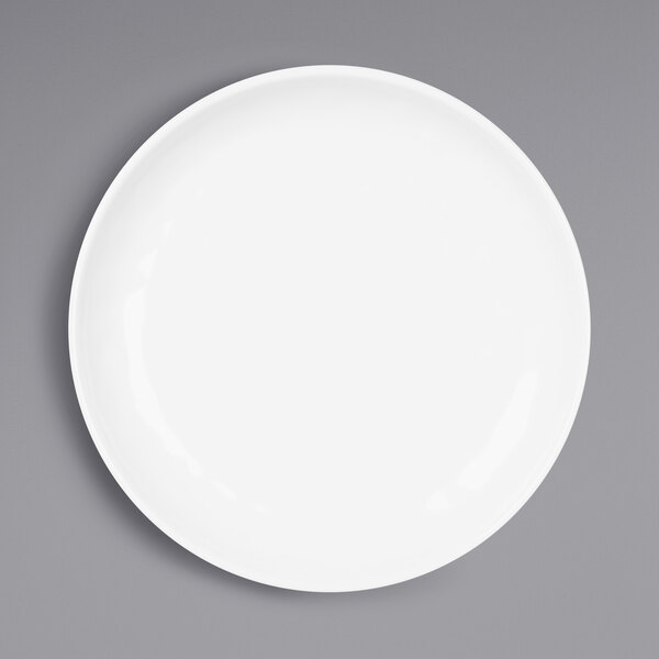 An Elite Global Solutions Ming white melamine plate on a gray surface.