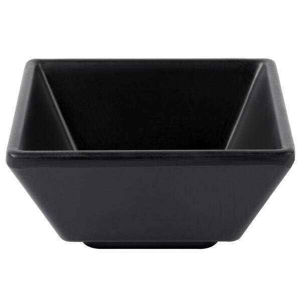A black square Elite Global Solutions melamine ramekin with a white triangle design.