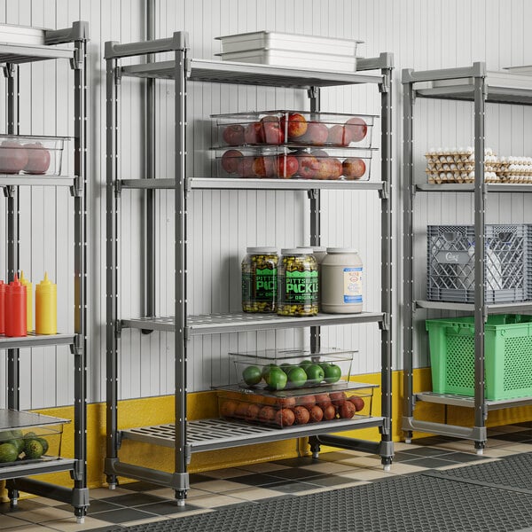 A metal shelving unit with four vented shelves, used for organized storage in commercial kitchens or pantries.