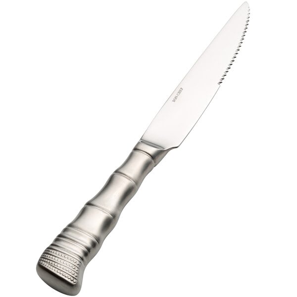 A Bon Chef stainless steel steak knife with a silver satin finish handle and blade.