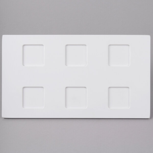 A white rectangular Elite Global Solutions melamine ramekin platter.