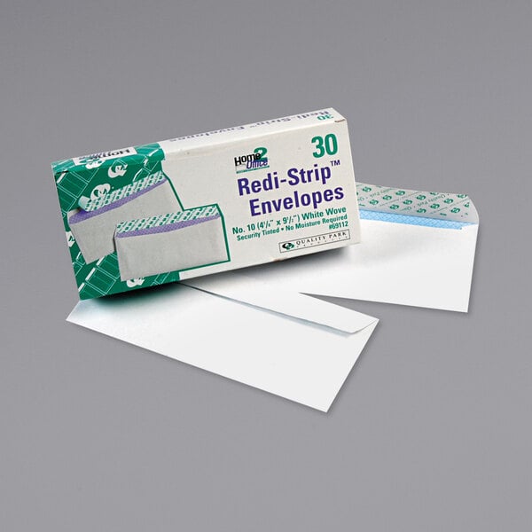 A box of 30 white Quality Park #10 business envelopes with a redi-strip seal.