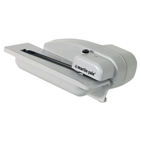 A white machine with a black handle designed to open letters.