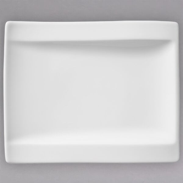A white rectangular Villeroy & Boch porcelain plate with a curved edge.