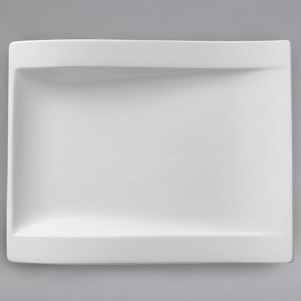 A white rectangular Villeroy & Boch porcelain plate with a curved edge.