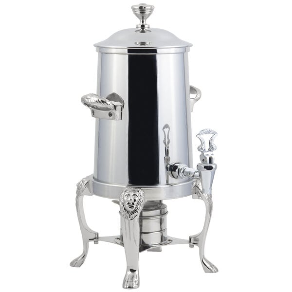 A Bon Chef stainless steel coffee chafer urn with chrome trim on a stand.